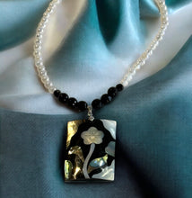 Load image into Gallery viewer, Black and white gemstone necklace with flower pendant
