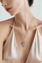 Load image into Gallery viewer, Necklace with a colorful pendant on a model wearing a beige top against a white background
