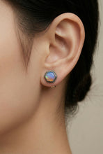 Load image into Gallery viewer, Close-up of an ear wearing a colorful stud earring with a neutral background