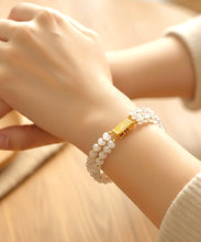 Load image into Gallery viewer, Cream gemstone and gold beaded handmade bracelet