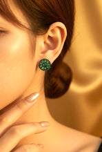 Load image into Gallery viewer, Close-up of a person wearing a green gemstone earring with a neutral background