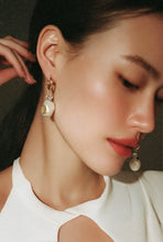 Load image into Gallery viewer, Close-up of a woman wearing a diamond earring with a neutral background