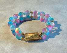 Load image into Gallery viewer, Multicolored beaded bracelet with a gold clasp on a light gray background