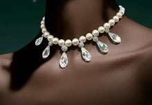 Load image into Gallery viewer, Pearl necklace with teardrop-shaped crystals on a dark background