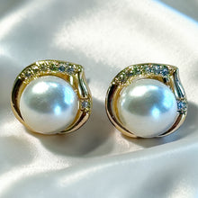 Load image into Gallery viewer, Pearl earrings with gold and gemstone accents on a white background