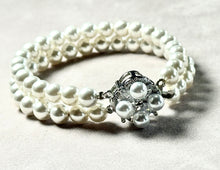 Load image into Gallery viewer, Pearl bracelet with a decorative clasp on a light background