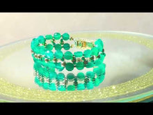 Load and play video in Gallery viewer, video of green woven bracelet