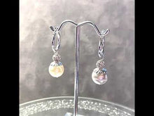 Load and play video in Gallery viewer, Video of white pearl drop bridal earrings