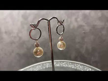 Load and play video in Gallery viewer, Video of white pearl drop earrings