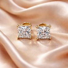 Load image into Gallery viewer, Gold square-cut gemstone earrings on a soft pink fabric background
