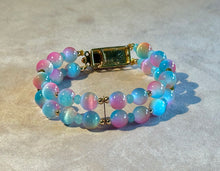 Load image into Gallery viewer, Multicolored beaded bracelet on a light gray background
