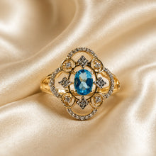 Load image into Gallery viewer, Blue topaz two tone gold and sterling silver filigree gemstone ring
