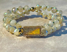 Load image into Gallery viewer, Beaded bracelet with a gold clasp on a light background
