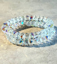 Load image into Gallery viewer, Crystal beaded bracelet on a sandy surface
