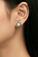 Load image into Gallery viewer, Close-up of an ear wearing a pearl earring with a blurred background
