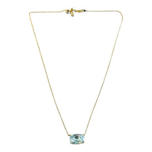 Load image into Gallery viewer, A delicate gold chain necklace featuring a small rectangular light blue gemstone pendant, displayed against a solid white background.
