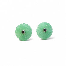 Load image into Gallery viewer, A pair of green jadeite flower-shaped stud earrings with a small silver-toned starburst center, shown on a plain white background.
