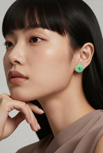 Load image into Gallery viewer, Close-up of a woman wearing a silver earring against a neutral background
