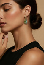 Load image into Gallery viewer, Close-up of a woman wearing  labradorite earrings with a neutral background
