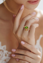 Load image into Gallery viewer, Peridot gemstone ring on models hands
