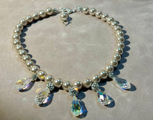 Load image into Gallery viewer, Pearl necklace with crystal pendants on a concrete surface
