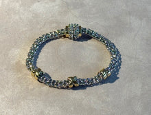 Load image into Gallery viewer, Bracelet with gold and silver links on a light gray background
