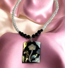 Load image into Gallery viewer, White and black gemstone necklace with flower pendant
