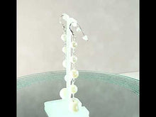 Load and play video in Gallery viewer, Long white pearl earrings
