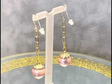 Load and play video in Gallery viewer, Video of pearl earrings in gold and pink
