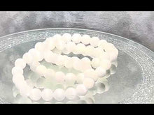 Load and play video in Gallery viewer, video of beaded white bracelet
