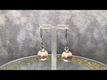 Load and play video in Gallery viewer, Video of blush mother of pearl earrngs

