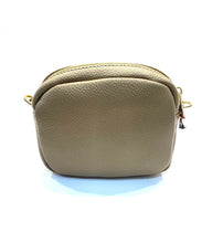Load image into Gallery viewer, Back view of beige leather bag with fabric strap
