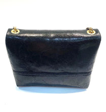 Load image into Gallery viewer, Back view of shiny small leather bag
