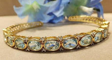 Load image into Gallery viewer, Blue topaz and gold bracelet
