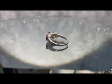 Load and play video in Gallery viewer, Video of amethyst and citrine three stone ring

